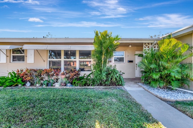 view of front of home with a front yard