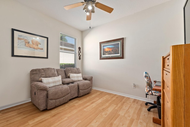 home office with ceiling fan, a textured ceiling, and hardwood / wood-style flooring