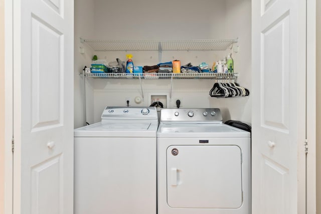 washroom featuring independent washer and dryer