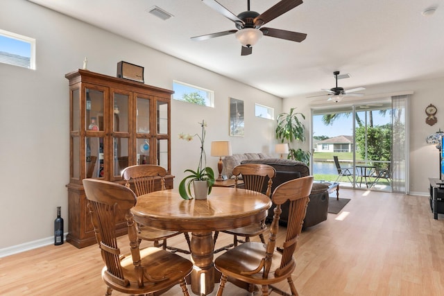 dining room featuring light hardwood / wood-style flooring and ceiling fan