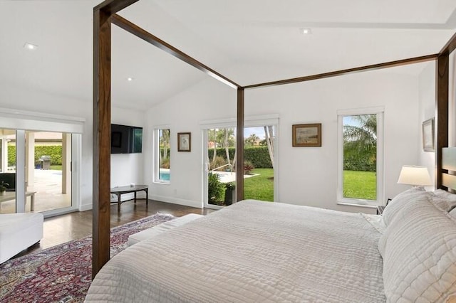 bedroom with hardwood / wood-style flooring, lofted ceiling, and access to outside