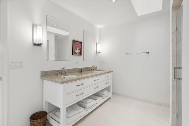 bathroom featuring tile patterned floors, vanity, and walk in shower