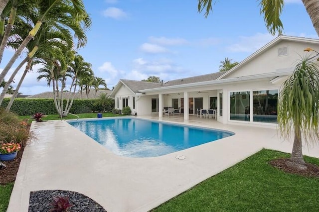 view of swimming pool with a patio area