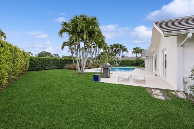 view of yard with a patio and a fenced in pool