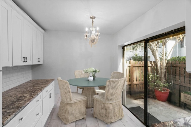 dining space featuring an inviting chandelier