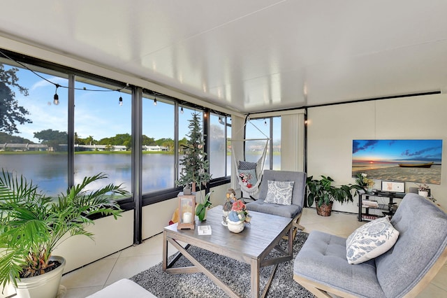 sunroom / solarium with a water view and a wealth of natural light