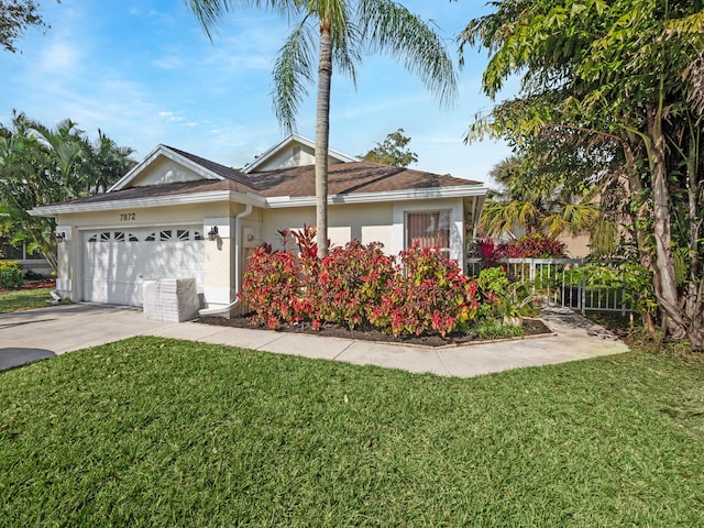 single story home with a garage and a front yard