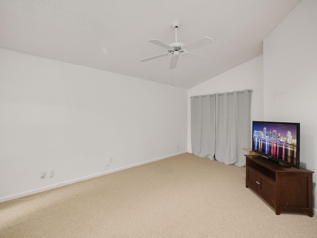 living room with ceiling fan, light colored carpet, and lofted ceiling