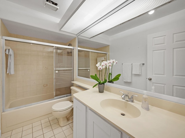 full bathroom featuring toilet, tile patterned floors, shower / bath combination with glass door, and vanity