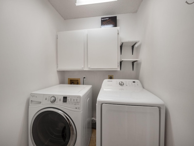 laundry area with cabinets and separate washer and dryer