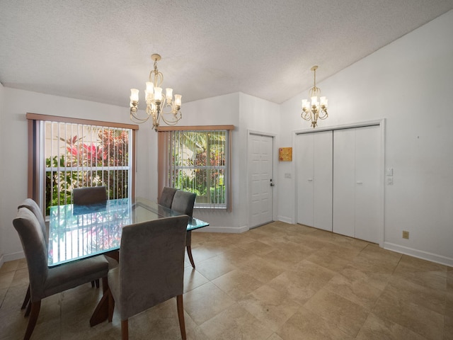 dining room featuring a chandelier, vaulted ceiling, and a textured ceiling