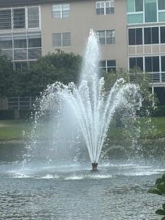 view of community with a water view