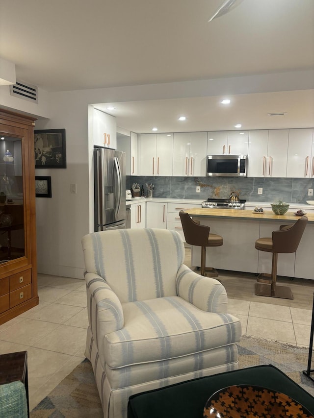 living room featuring light tile patterned floors