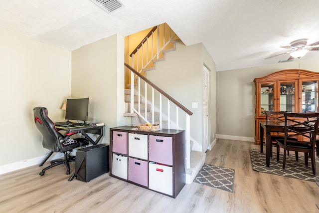 office with ceiling fan, vaulted ceiling, and light wood-type flooring