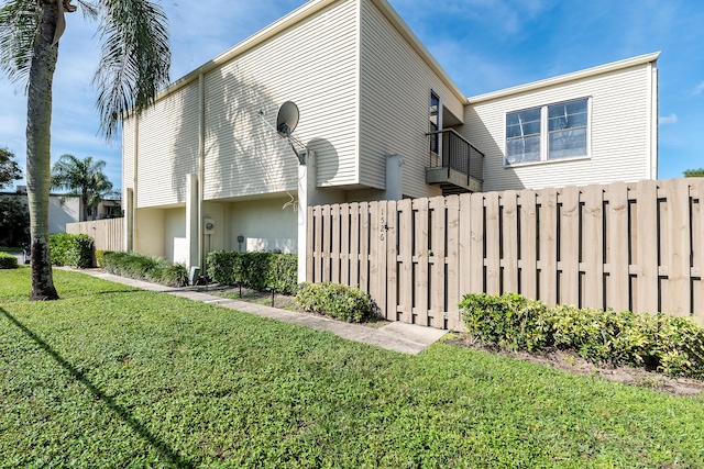 view of home's exterior featuring a balcony