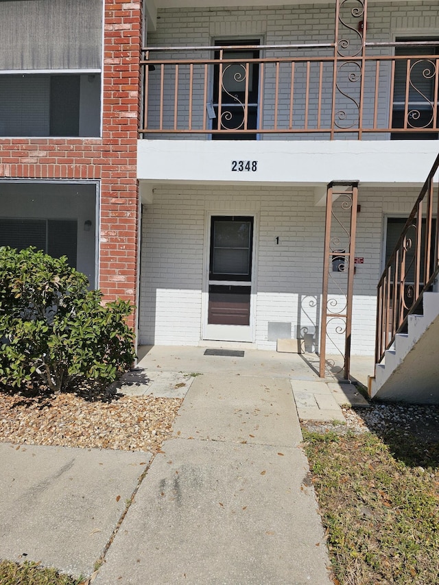 property entrance with a balcony