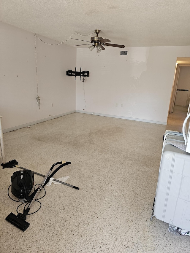 interior space featuring ceiling fan