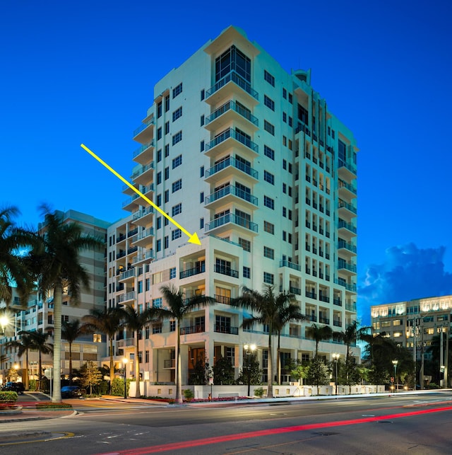 view of outdoor building at dusk