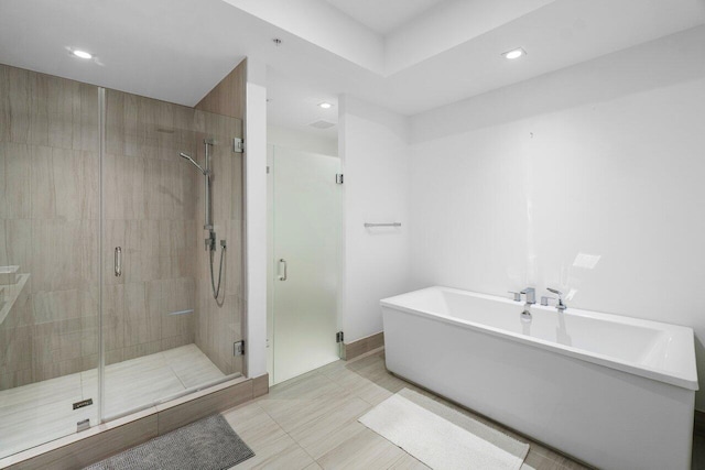 bathroom featuring plus walk in shower