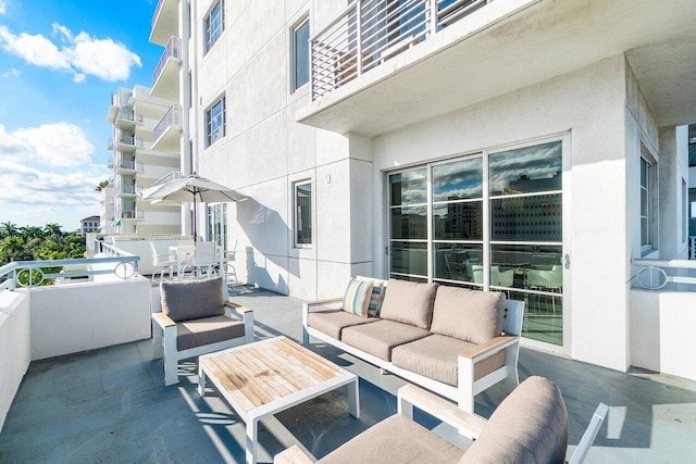 view of patio / terrace with an outdoor living space and a balcony