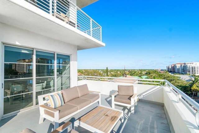 view of patio / terrace with a balcony and an outdoor hangout area