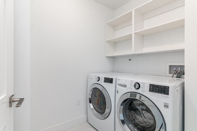 clothes washing area featuring washing machine and dryer