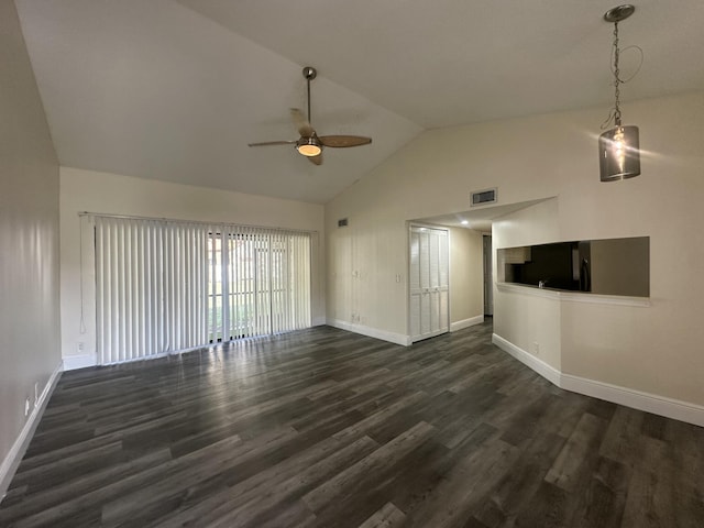 unfurnished living room with vaulted ceiling, dark wood-type flooring, and ceiling fan