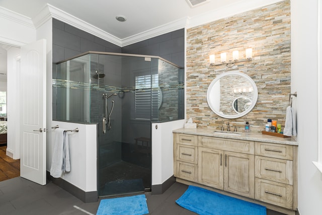 full bath with visible vents, ornamental molding, a shower stall, and vanity