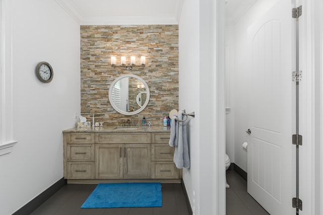 bathroom with ornamental molding, tile patterned flooring, and toilet