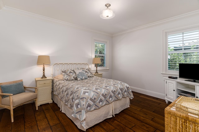 bedroom with dark wood-style floors, baseboards, and crown molding