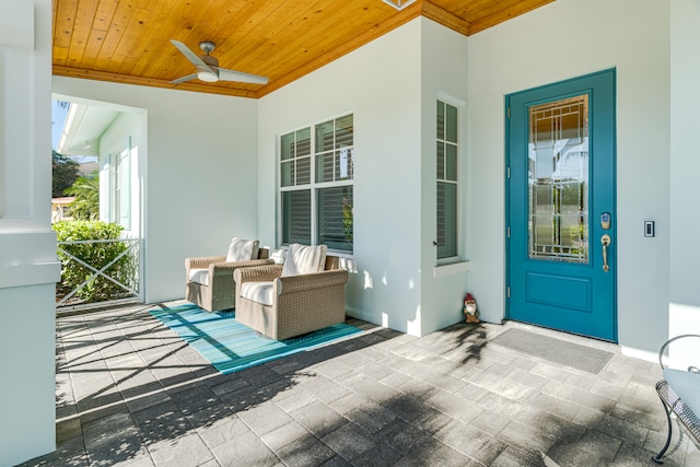 view of exterior entry with ceiling fan