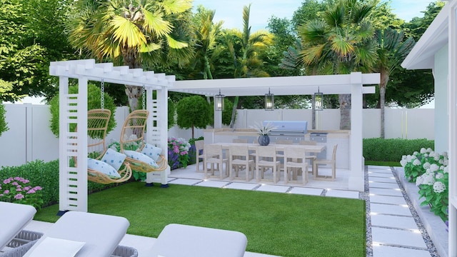 view of patio with a grill, fence, and an outdoor kitchen