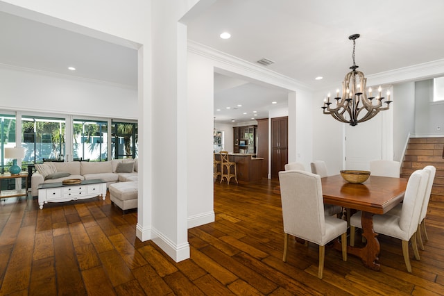 dining area with a notable chandelier, recessed lighting, visible vents, dark wood finished floors, and crown molding