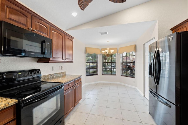 kitchen featuring light stone countertops, hanging light fixtures, an inviting chandelier, vaulted ceiling, and black appliances