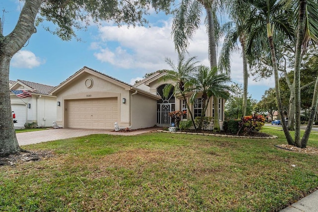 view of front facade with a front yard and a garage