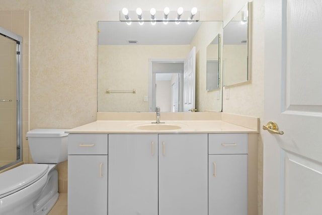 bathroom featuring walk in shower, vanity, and toilet