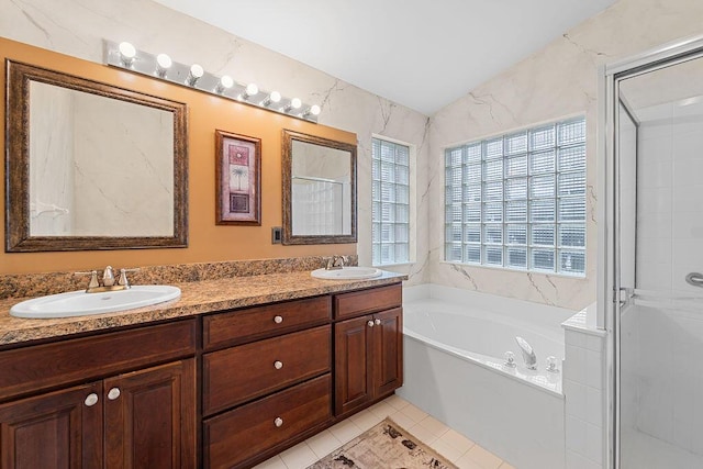 bathroom featuring tile patterned floors, plenty of natural light, lofted ceiling, and plus walk in shower