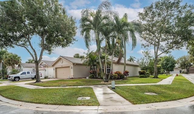 single story home featuring a front yard and a garage