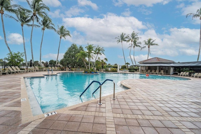 view of swimming pool featuring a patio area