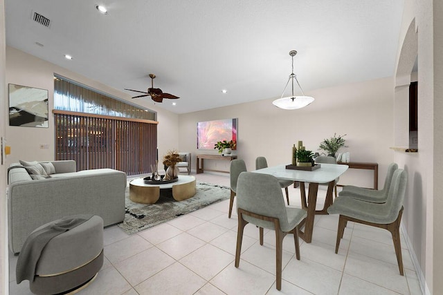 dining area featuring ceiling fan and light tile patterned flooring