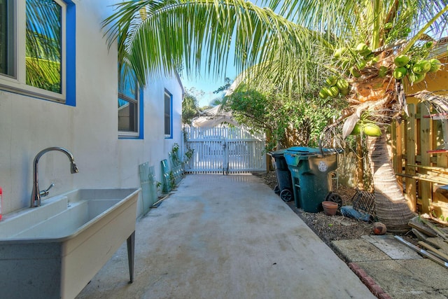 726 N E St, Lake Worth Beach, FL 33460 - view of patio / terrace with a gate and a sink