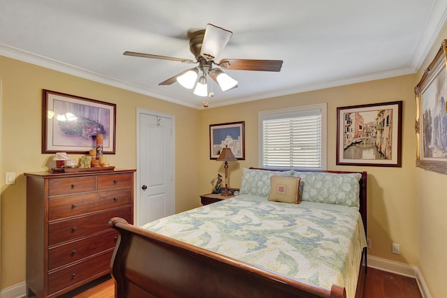 bedroom with ceiling fan, hardwood / wood-style flooring, and ornamental molding