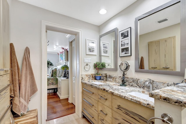 bathroom featuring vanity and wood-type flooring