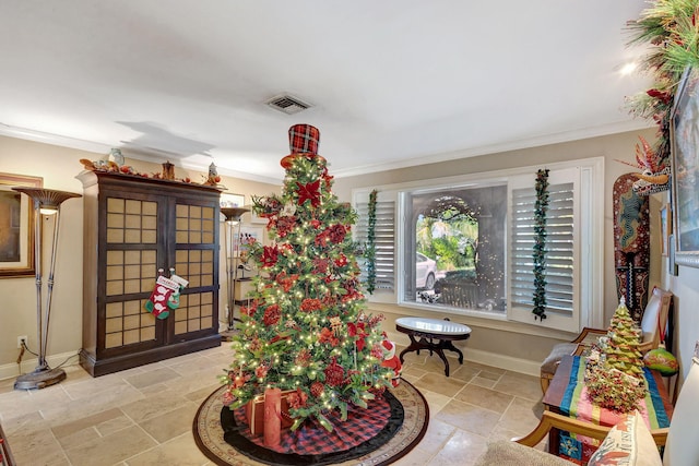 interior space with french doors and crown molding