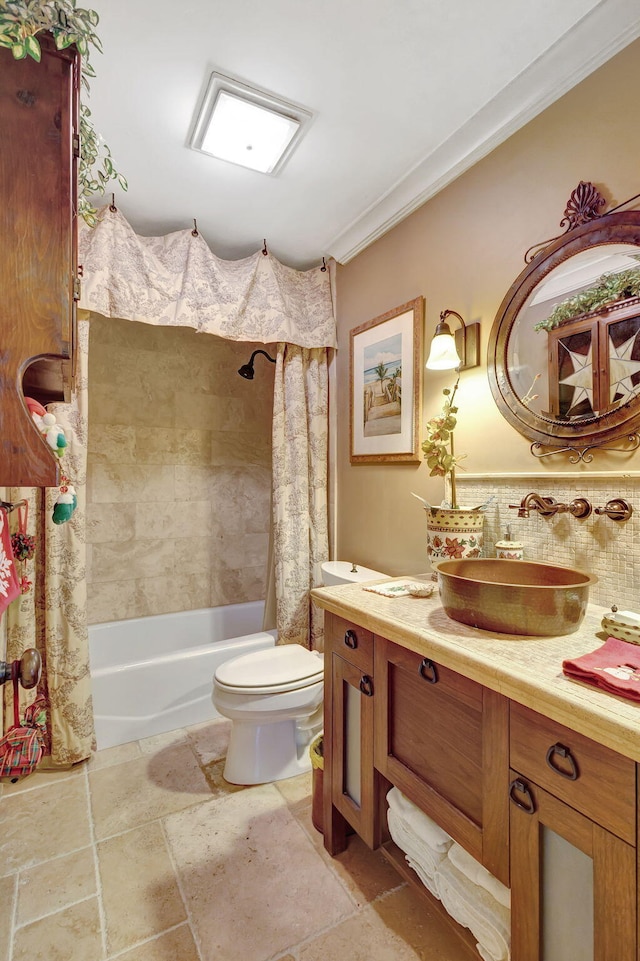 full bathroom featuring vanity, backsplash, crown molding, toilet, and shower / bath combo with shower curtain