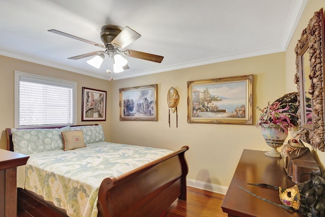 bedroom featuring ceiling fan, dark hardwood / wood-style floors, and ornamental molding