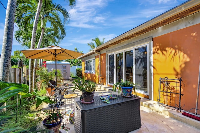 view of patio with a shed