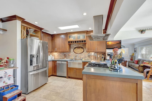 kitchen with decorative backsplash, ornamental molding, stainless steel appliances, island range hood, and sink