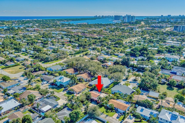 birds eye view of property with a water view