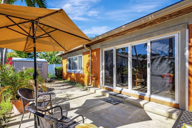 view of patio / terrace with an outbuilding